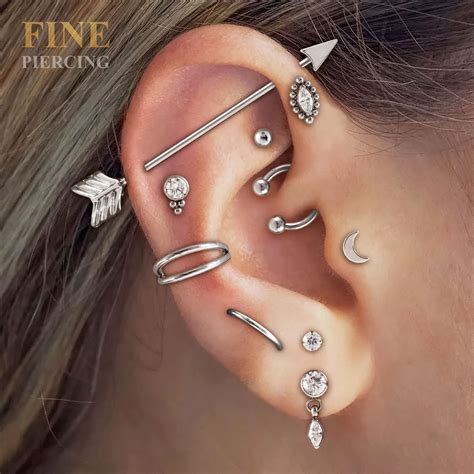 smoke piercing|smoke dragon piercing, piercing de titanio, piercing de orelha